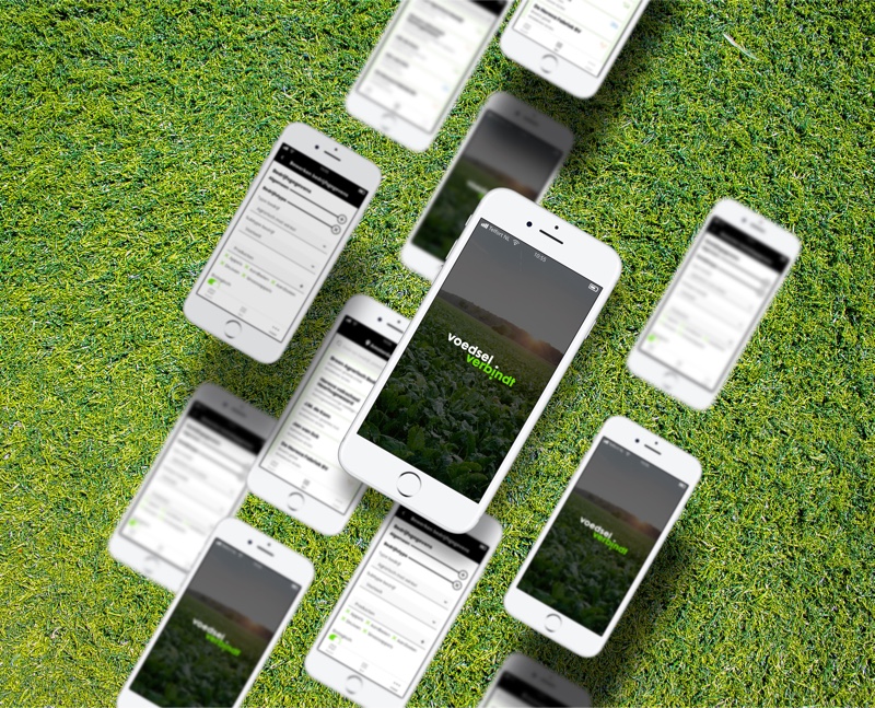 Sfeerbeeld van telefoons die boven gras lijken te zweven en schermen van de Voedsel Verbindt ap vertonen.
